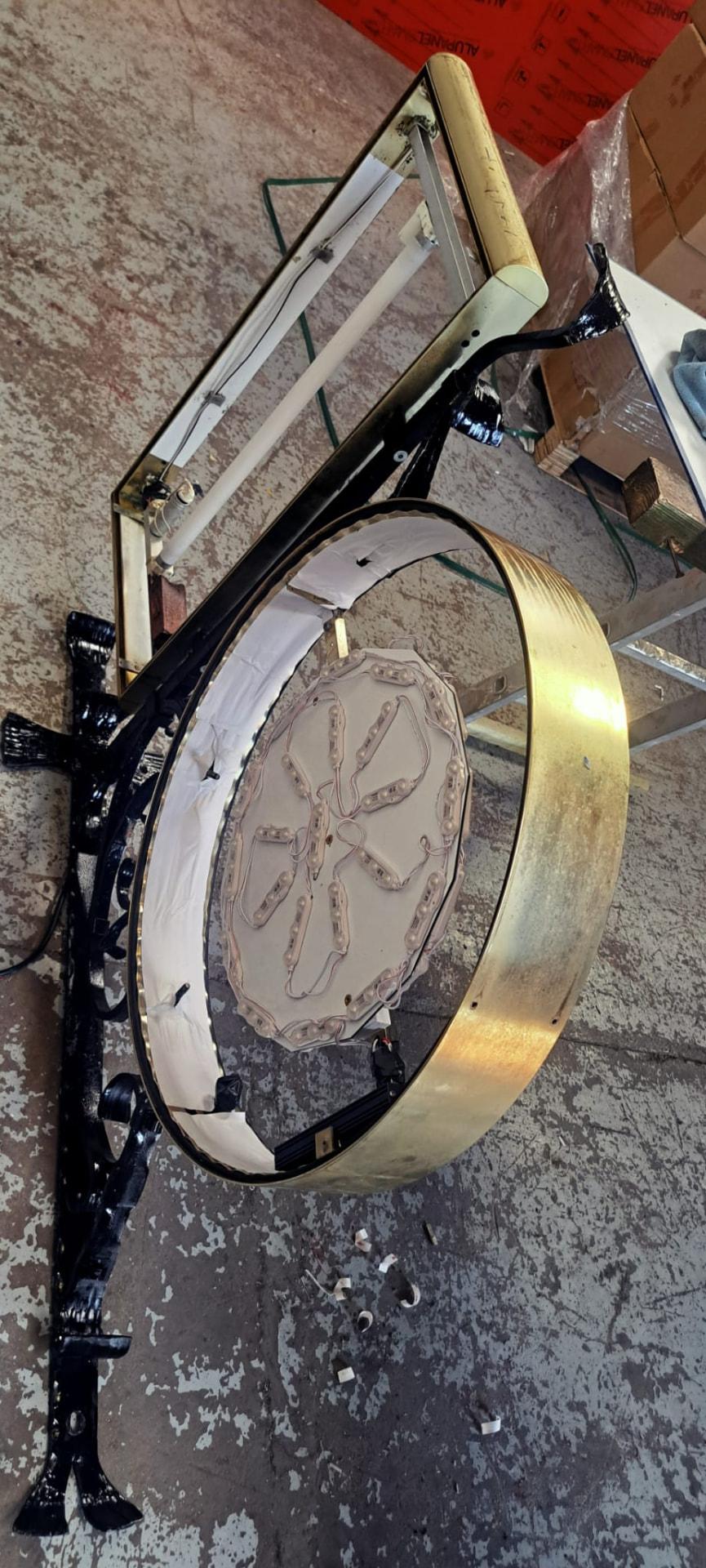 Sign internals being retrofitted with LED modules in the workshop